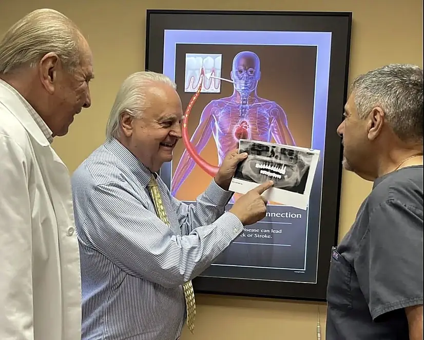 Dr. Kurpis and colleagues reviewing the link between gum disease and systemic health.